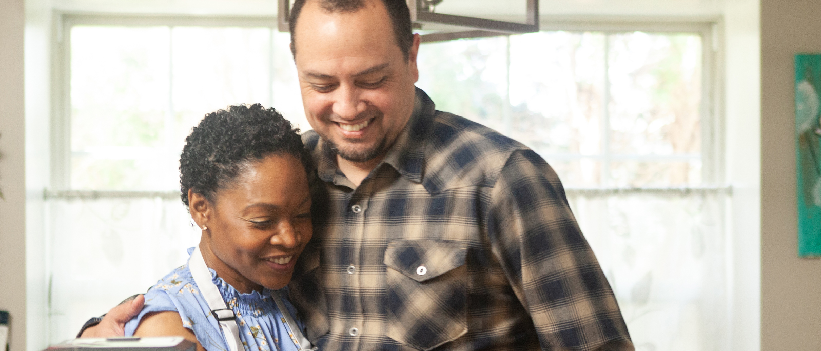 a man and a woman smiling