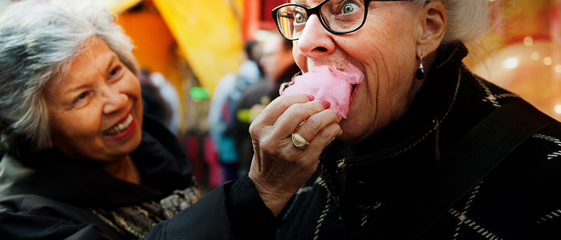 a person eating a pink apple