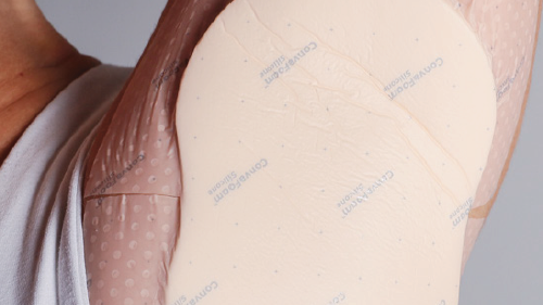 a close-up of a hand holding a piece of paper